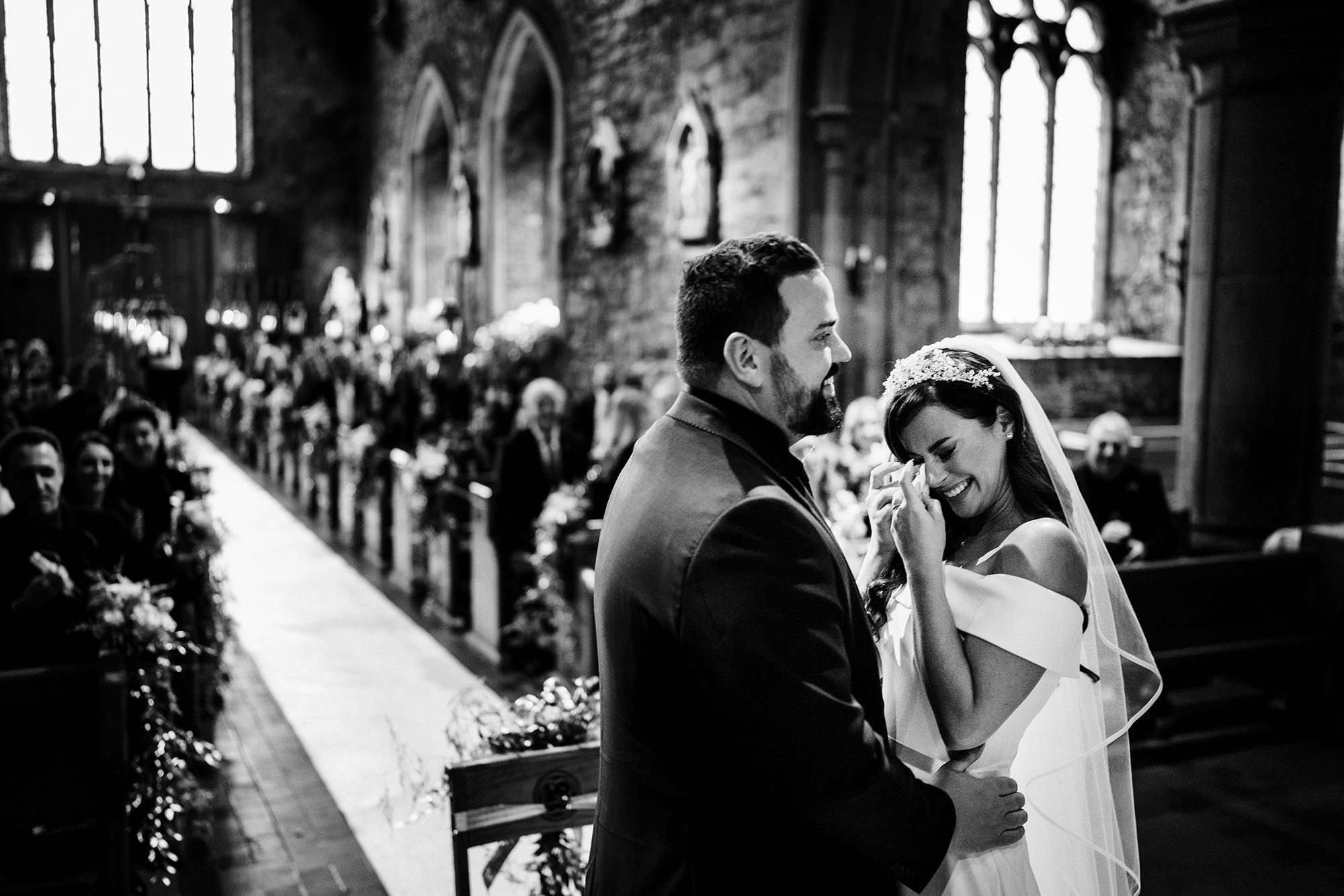 Bride and groom sharing a natural moment at Adare Manor