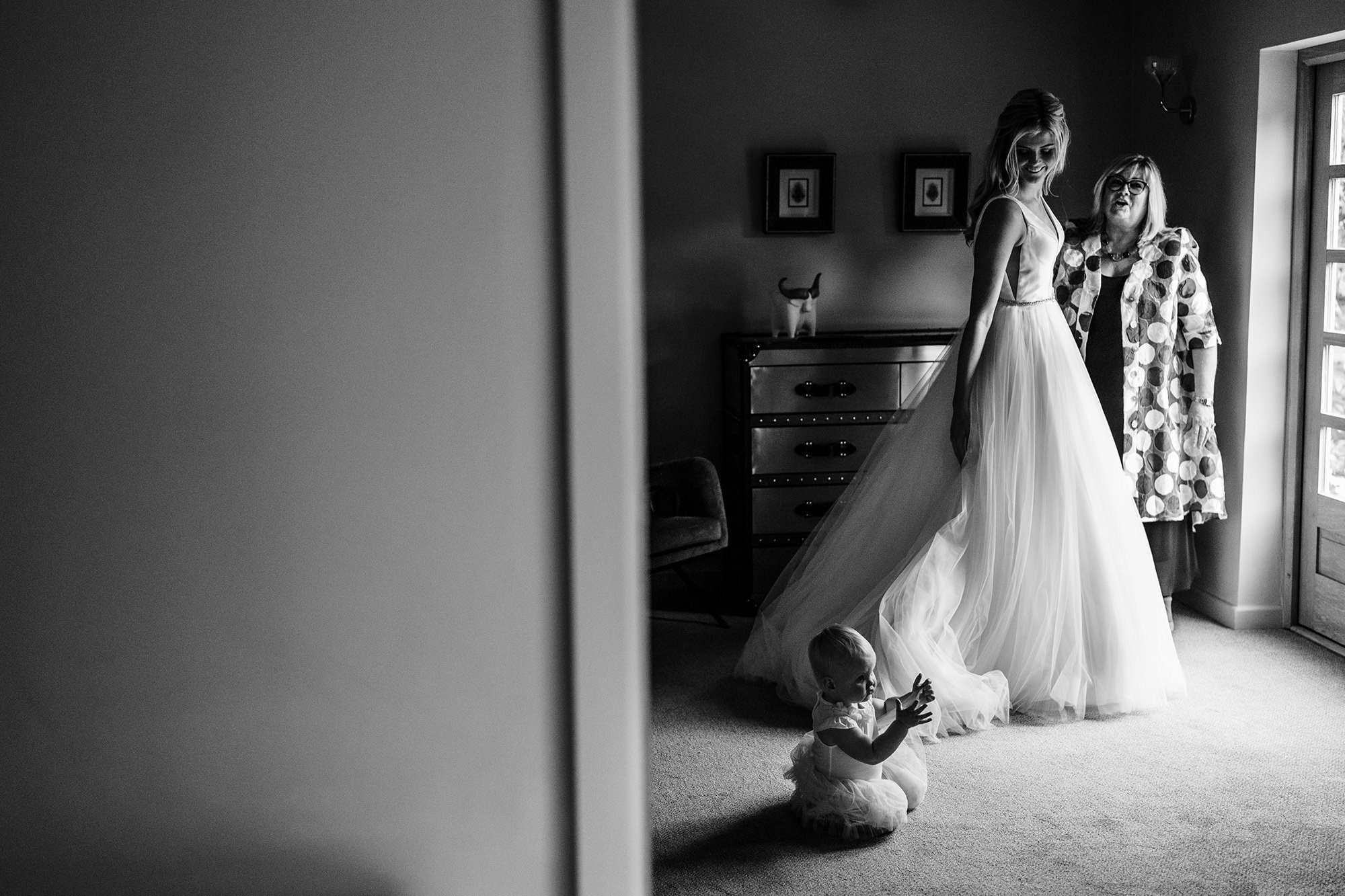 Atmospheric candid wedding photograph with genuine emotion