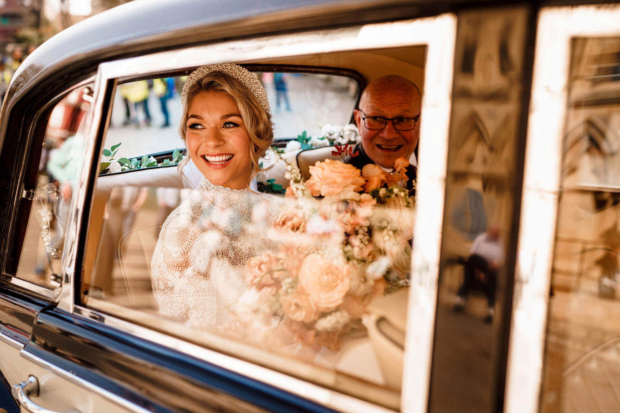 Bride arriving in a wedding car at a Cotswolds wedding venue