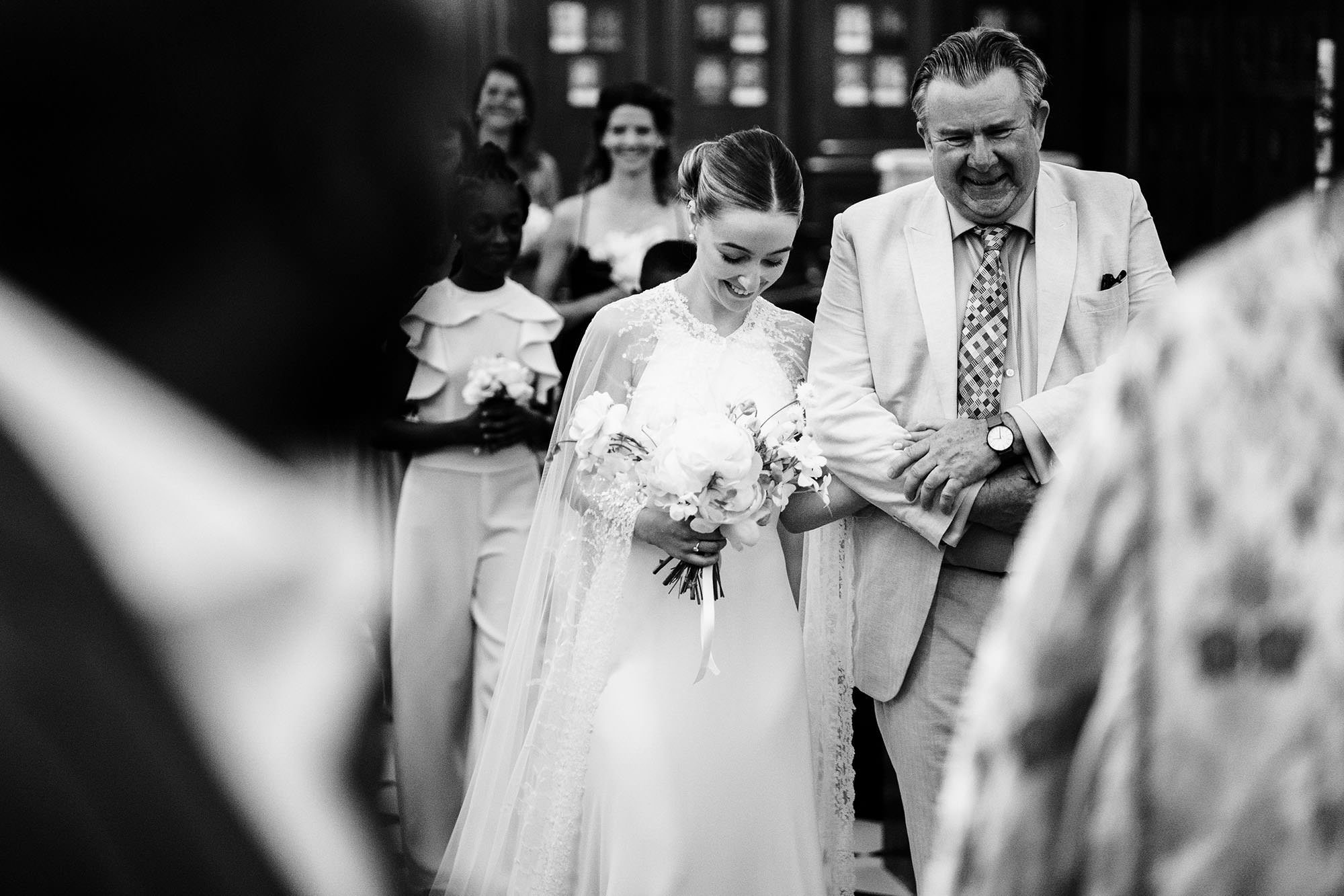 Bride walking into ceremony with her dad
