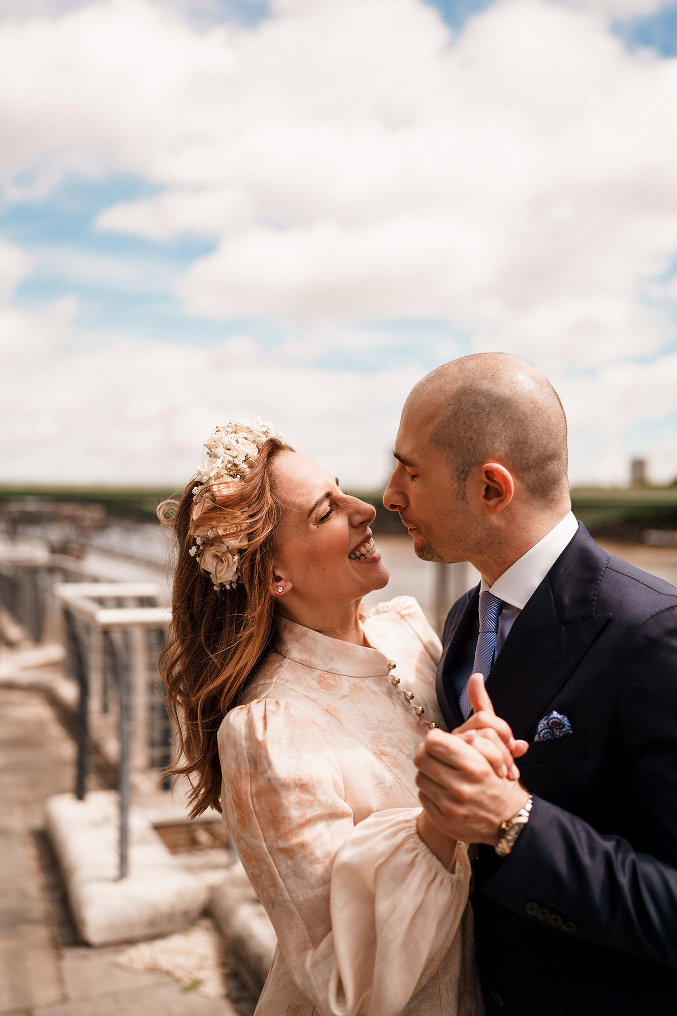 Bride and groom at home before their intimate London wedding
