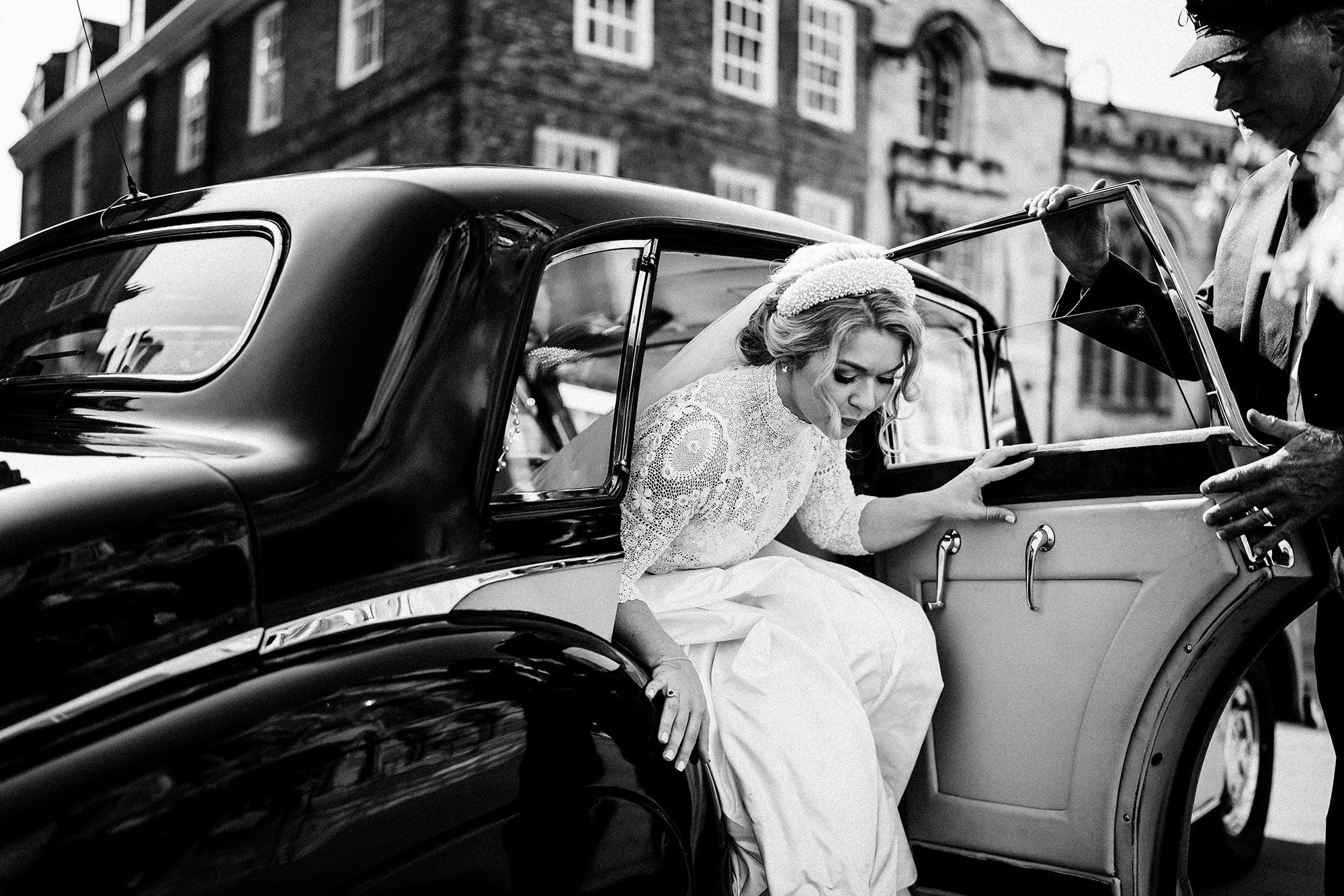 Bride smiling naturally during wedding preparations in soft light